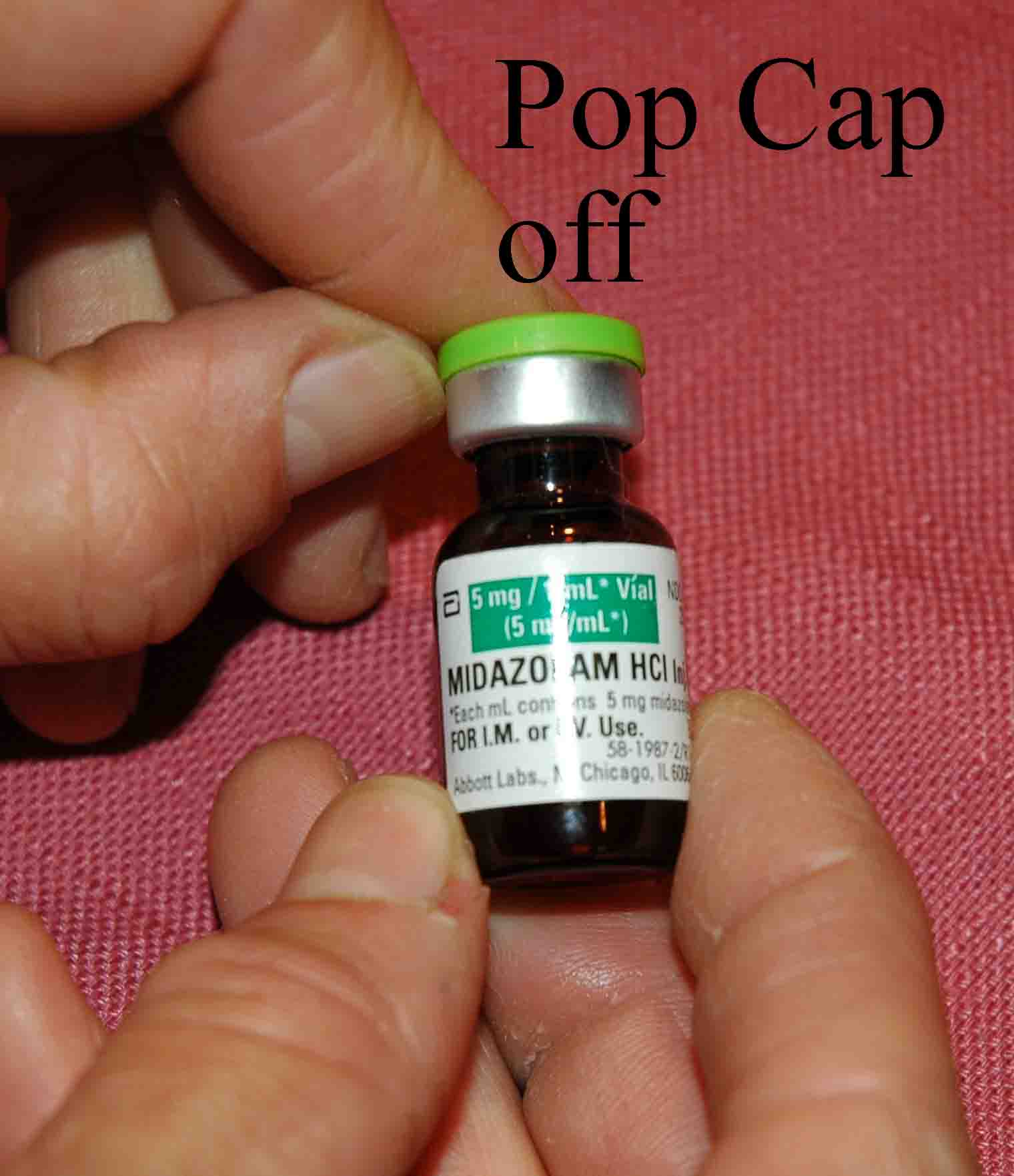 Pop cap off the midazolam vial