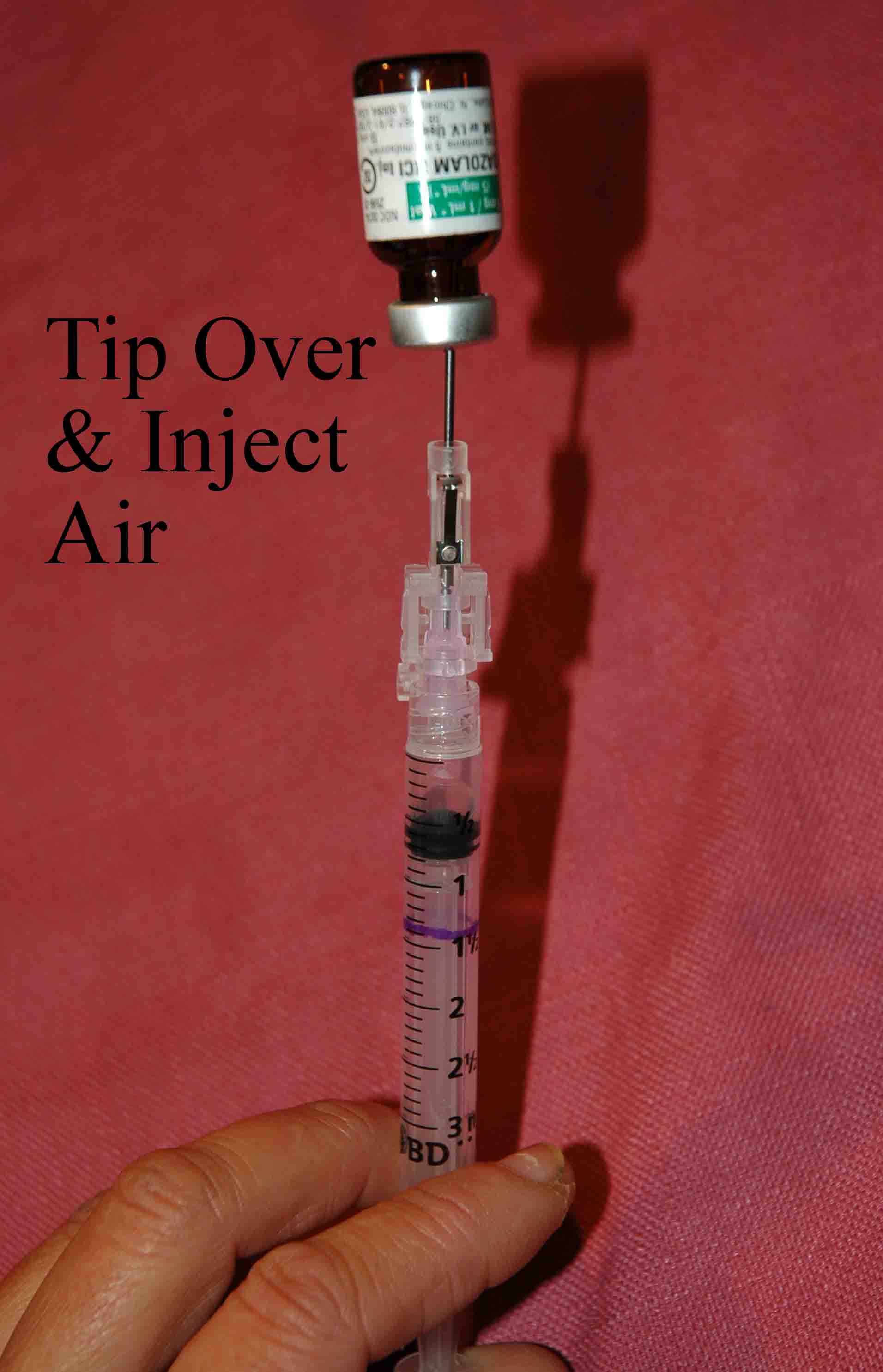 Inject air into the vial and tip it upsidedown