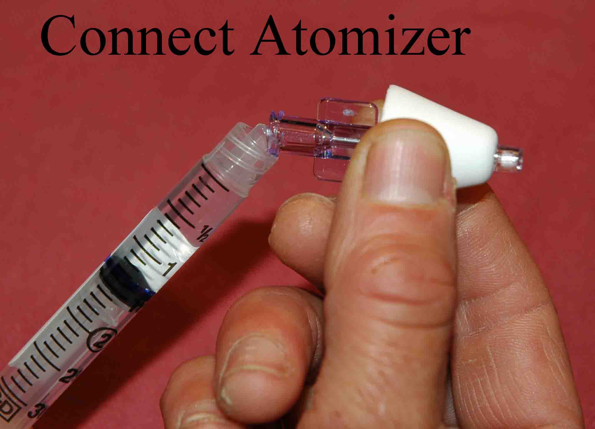 Connect atomizer tip to syringe
